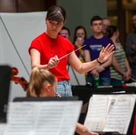 A Youth Symphony Orchestra of East Central Indiana member conducts the orchestra during the April 13 concert in the Muncie Mall. Breanna Daugherty | SFG