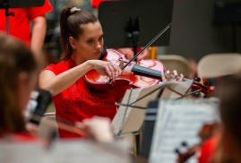A Youth Symphony Orchestra of East Central Indiana member plays the violin at the Muncie Outreach concert on April 13 at the Muncie Mall. Breanna Daugherty | SFG