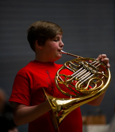 A Youth Symphony Orchestra of East Central Indiana member plays the French horn at the Muncie Outreach concert on April 13 at the Muncie Mall. Members of the orchestra learn to perform orchestral masterworks, both traditional and contemporary. Breanna Daugherty | SFG