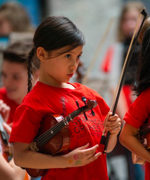 One of Youth Symphony Orchestra of East Central Indiana members waits for the final song to begin of the Muncie Outreach concert on April 13 at the Muncie Mall. The orchestra is geared toward students of all ages. Breanna Daugherty | SFG